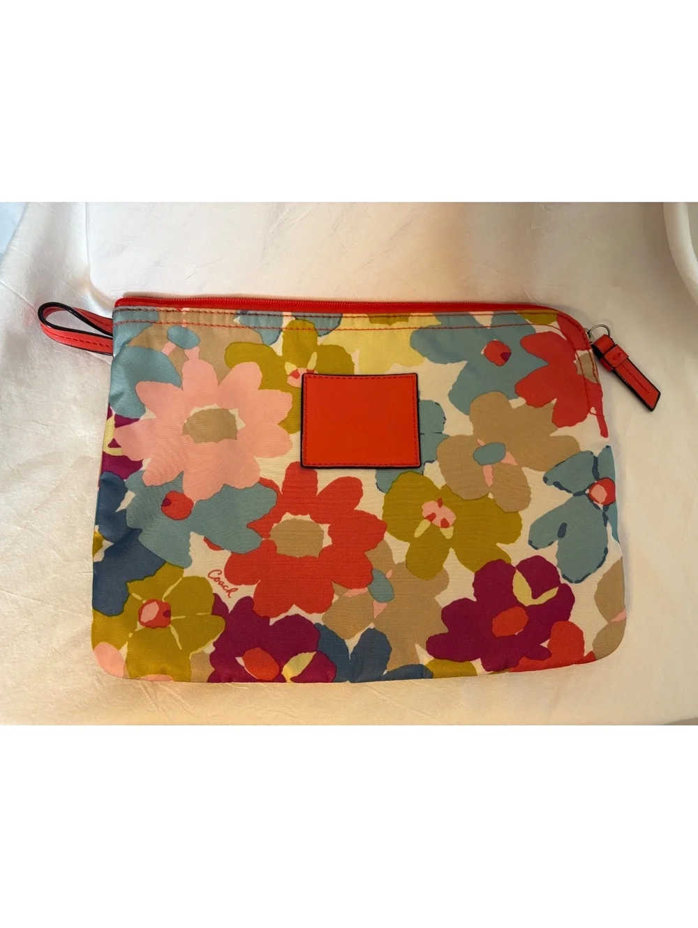Bright and cheerful Coach tote featuring an oversized multicolor floral print.